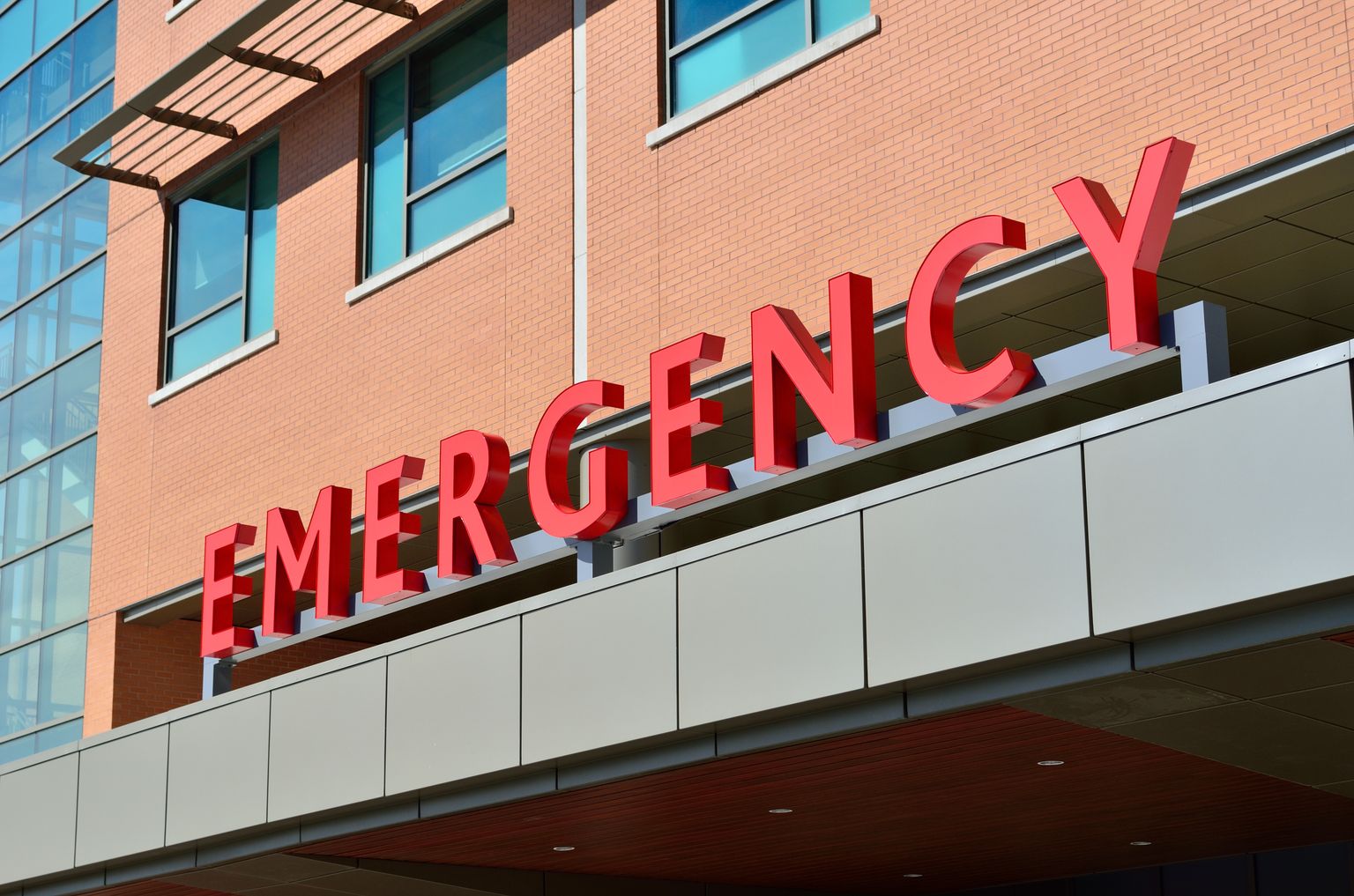 Hospital entrance with red Emergency signage